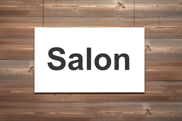 White canvas hanging on wooden wall salon — Stock Photo, Image