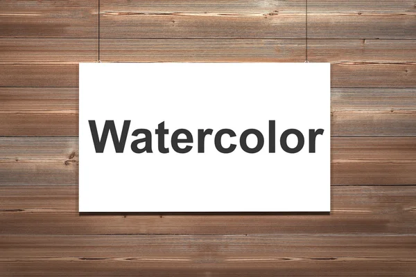 White canvas hanging on brown wooden wall watercolor — Stock Photo, Image