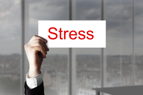Businessmans hand hebt omhoog teken stress — Stockfoto