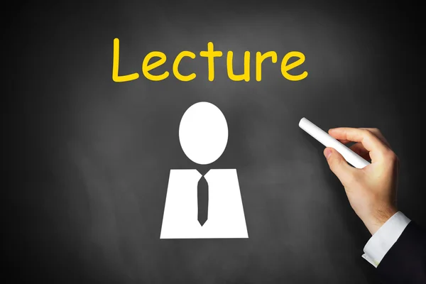 Hand writing lecture on black chalkboard — Stock Photo, Image