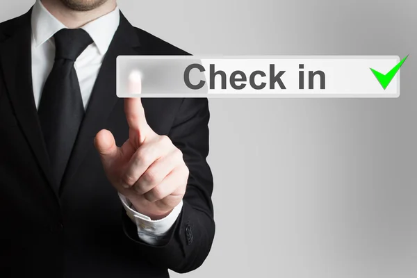 Businessman pressing button check in — Stock Photo, Image