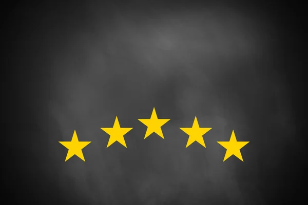 Five golden stars on black chalkboard — Stock Photo, Image