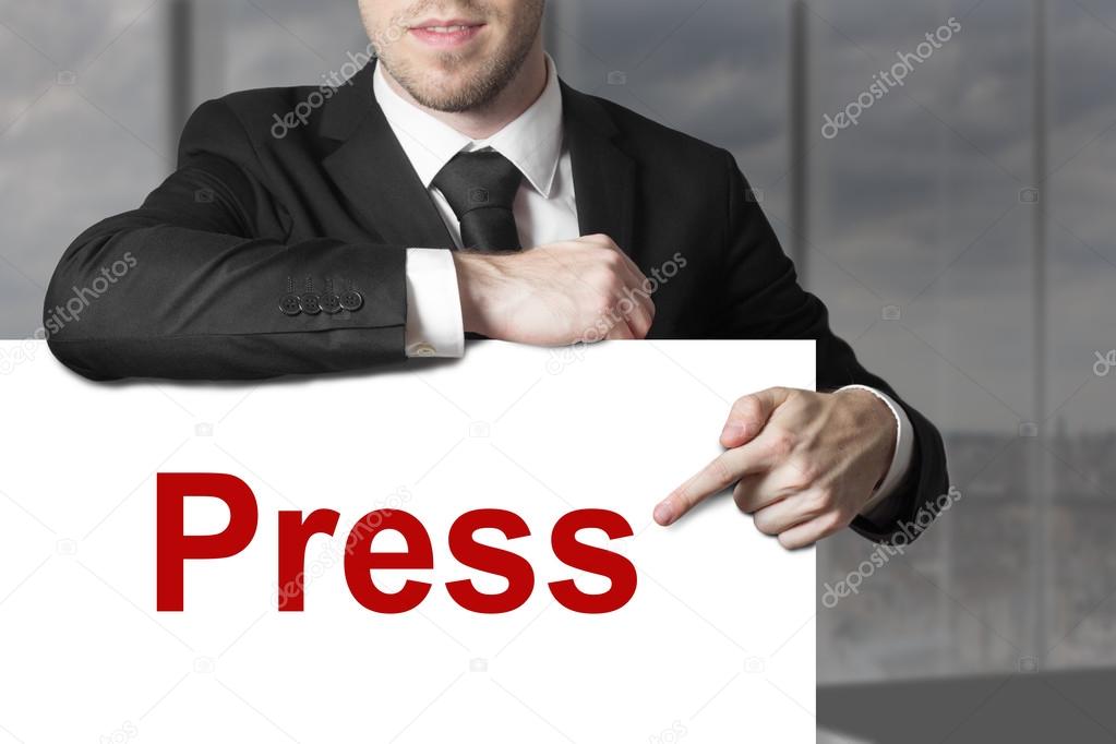 businessman pointing on sign press