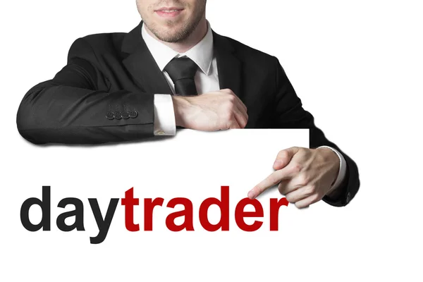 Biznesmen, wskazując na znak Daytrader artykuł na białym tle — Zdjęcie stockowe