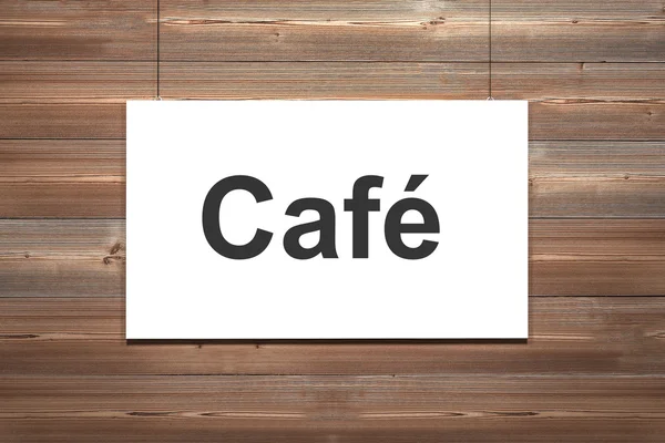 Холст висит на деревянной стене кафе — стоковое фото