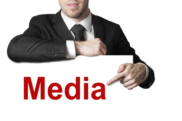 Empresario apuntando a medios de comunicación aislados — Foto de Stock