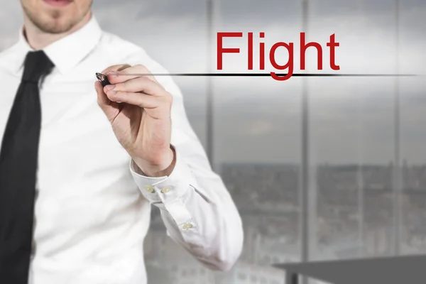 Hombre de negocios escribiendo vuelo en el aire — Foto de Stock