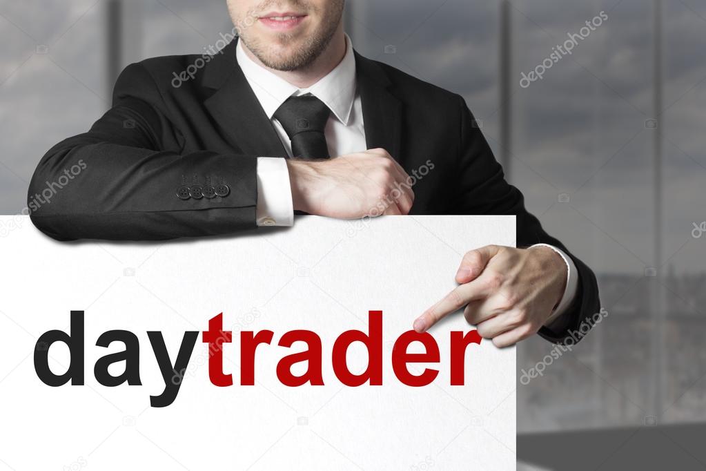 Businessman pointing on sign daytrader