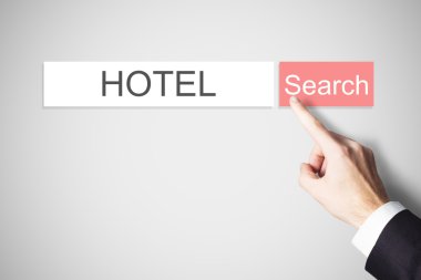 businessmans finger pressing search button hotel webbrowser