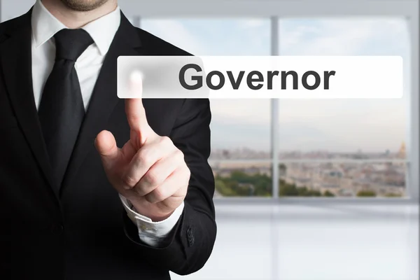 Businessman in office pushing button governor — Stock Photo, Image