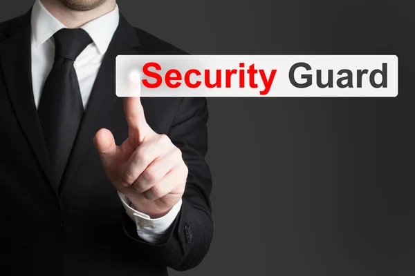 Businessman pushing flat button security guard — Stock Photo, Image