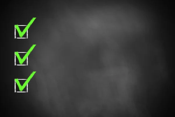 Three green marked checkboxes on  chalkboard — Stockfoto