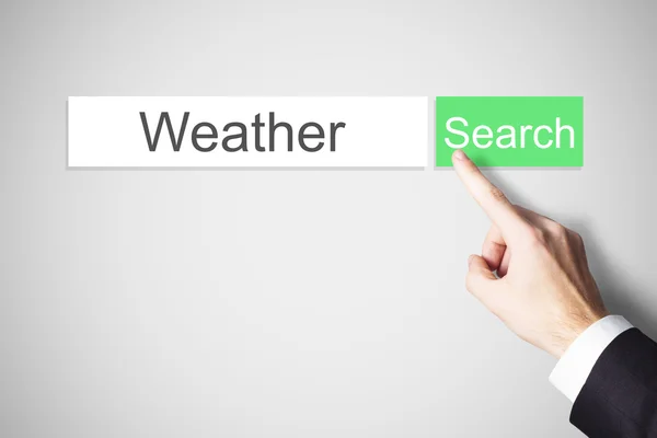 Prstem tlačí zelené webové vyhledávací tlačítko počasí — Stock fotografie