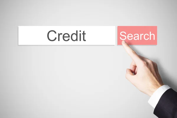 Dedo empurrando vermelho web crédito botão de pesquisa — Fotografia de Stock