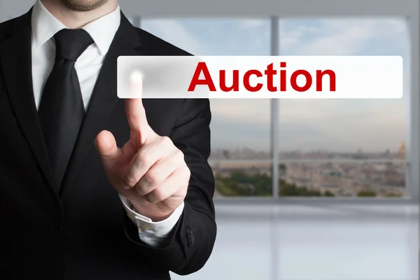 Businessman pushing button auction — Stock Photo, Image