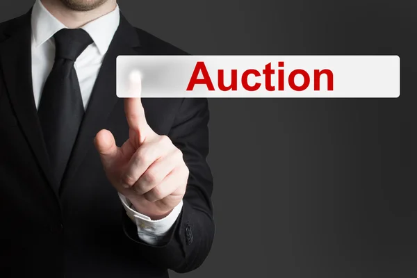 Businessman pushing button auction — Stock Photo, Image