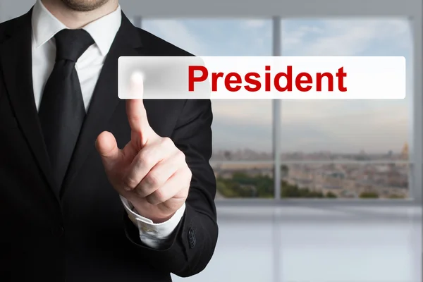 Businessman pushing flat button president — Stock Photo, Image