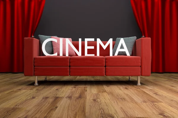 Červený gauč před oponou velké kino — Stock fotografie