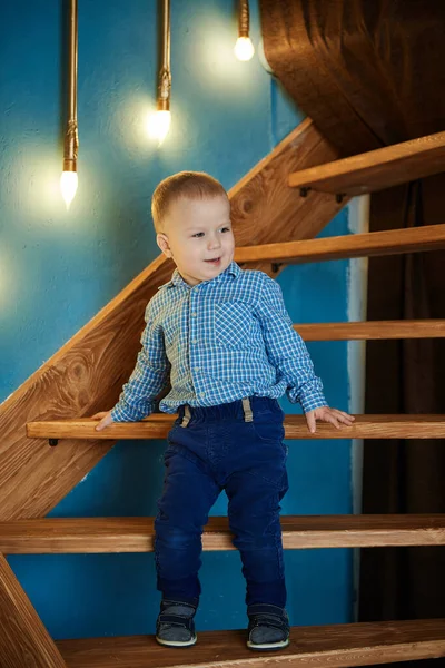 Small Beautiful Boy Standing Wooden Staircase Leaning Two Hands Step Royalty Free Stock Photos