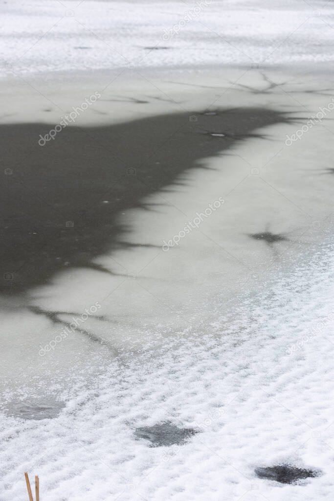 vertical winter pond frozen water different textures in the ixe