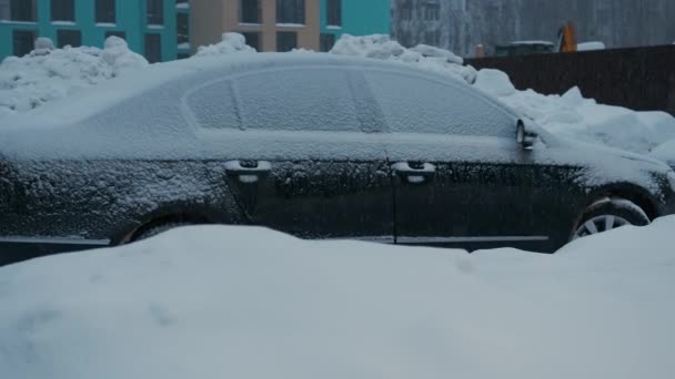 Ar was covered with snow in the parking lot — Stock Video