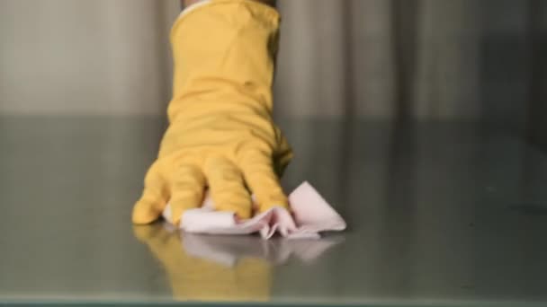 Close-up of a hand with yellow gloves cleaning on the table. Disinfection. Cleaning company — Stock Video