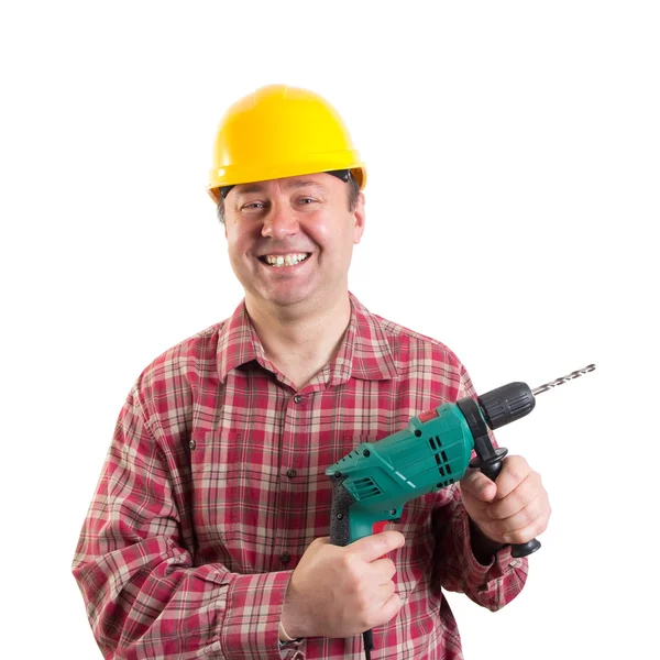 Sonriente trabajador con un taladro, recorte camino incluido — Foto de Stock