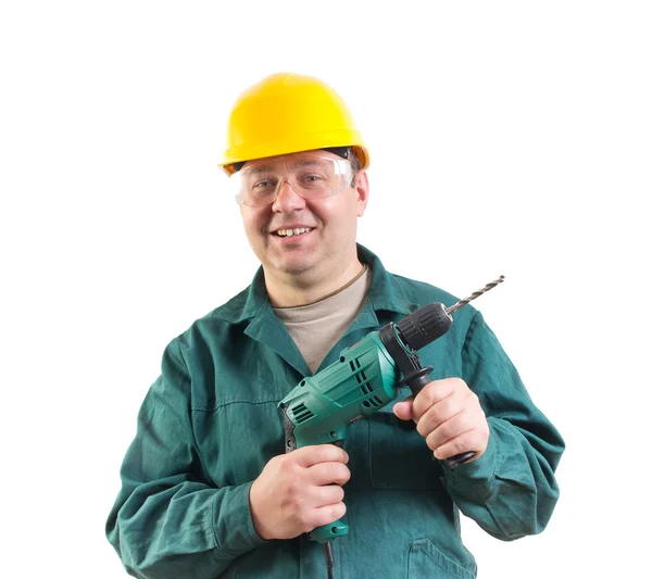 Sonriente trabajador con un taladro, recorte camino incluido — Foto de Stock