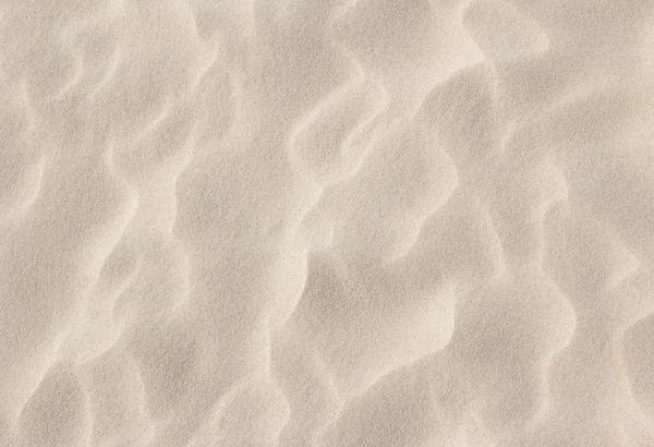 Primer plano de arena de playa textura de fondo — Foto de Stock