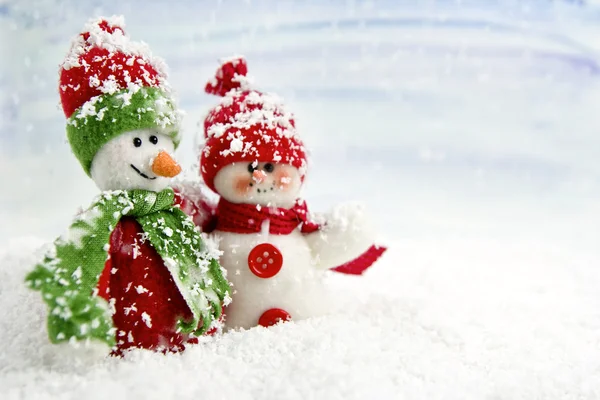 Two smiling snowmen friends in the snow — Stock Photo, Image