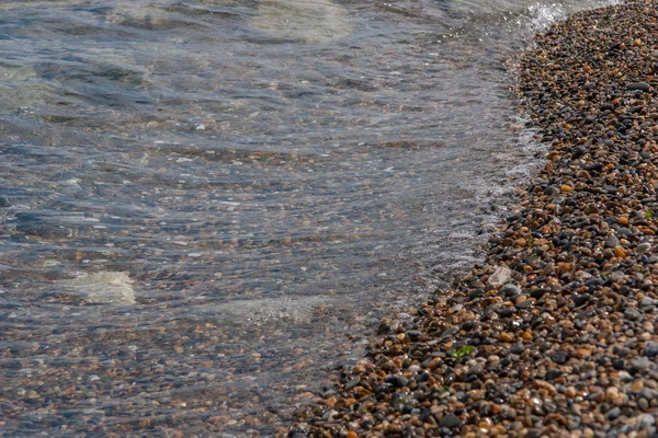 Surf in small stones — Stock Photo, Image