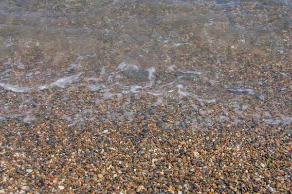 Surf in small stones — Stock Photo, Image