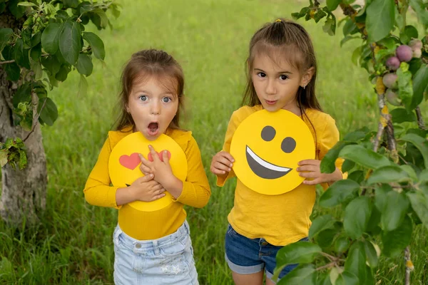 Sisters Holding Faces Happy Emoticons Hands Two Girlfriends Park Apple — Stok Foto