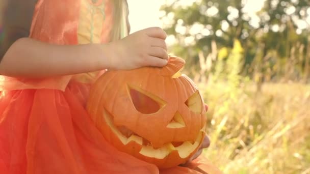 Girl Opens Lid Empty Carved Sinister Pumpkin Sunset Outdoors Jack — Stock Video