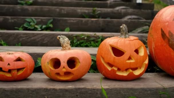 Four Empty Pumpkins Carved Faces Standing Steps Old Staircase House — Stock Video