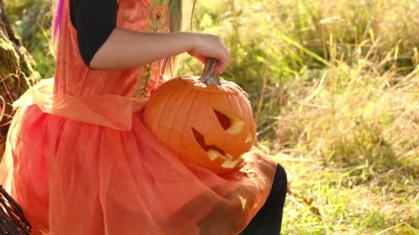 Girl Holds Her Hands Pumpkin Sinister Head Jack Lantern Child — Stock Video
