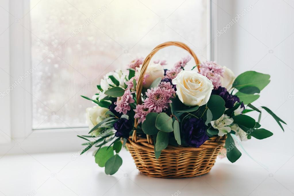 basket of flowers on the window, vintage colors