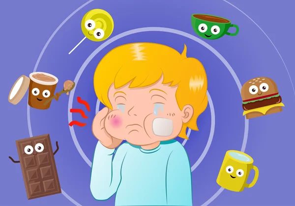 Мальчик с зубной болью, окруженный сладкой едой — стоковое фото