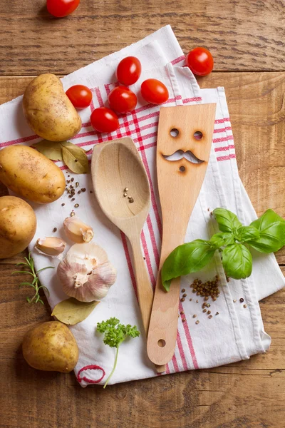 Wooden spoon, spatula and spices — Stock Photo, Image