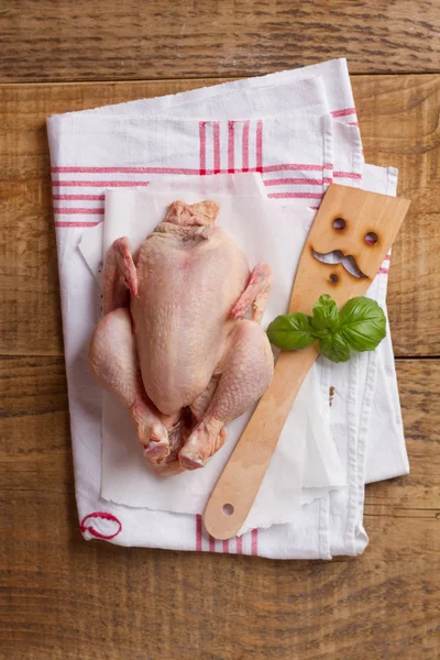 Whole chicken with spatula — Stock Photo, Image