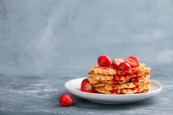 Plate of waffles with strawberry  sauce — Stock Photo, Image