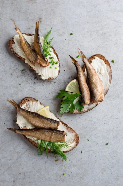 Sandwiches with sprats or sardines — Stock Photo, Image