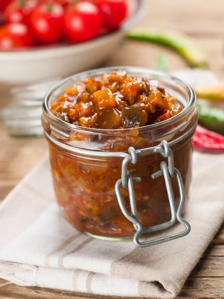 Vegetable sauce in glass jar — Stock Photo, Image