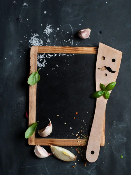 Vintage chalk board with spatula and spice — Stock Photo, Image