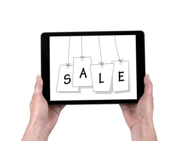 Kadınların elleri ve satış düzenlenen tablet