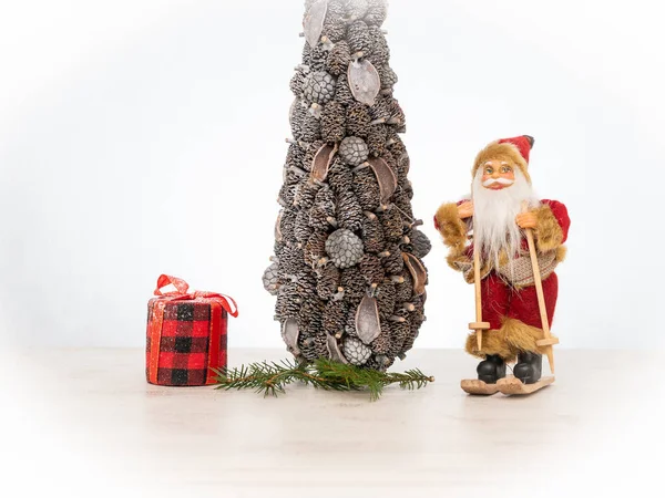 Santa Claus Skis Stands Next Christmas Tree Red Gift Tartan Royalty Free Stock Photos