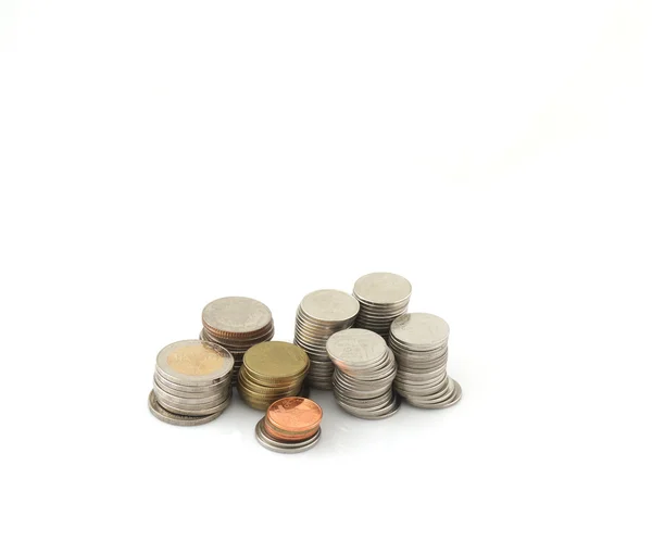 Monedas sobre fondo blanco — Foto de Stock
