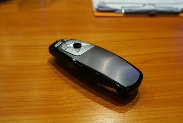Remote control in conference room — Stock Photo, Image