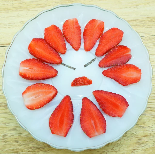 Angry strawberry on plate — Stock Photo, Image