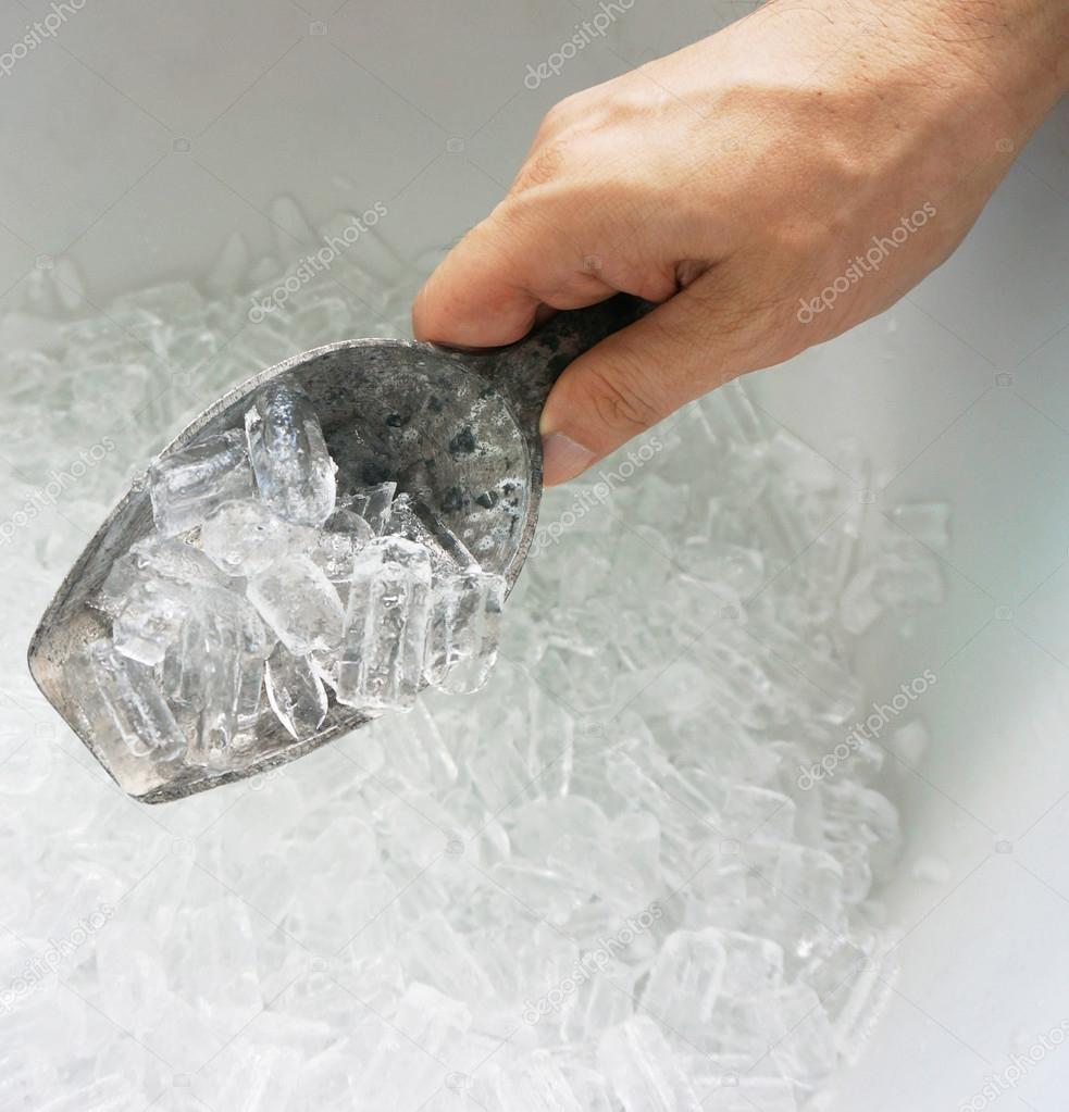 Hand of man hold ice scoop